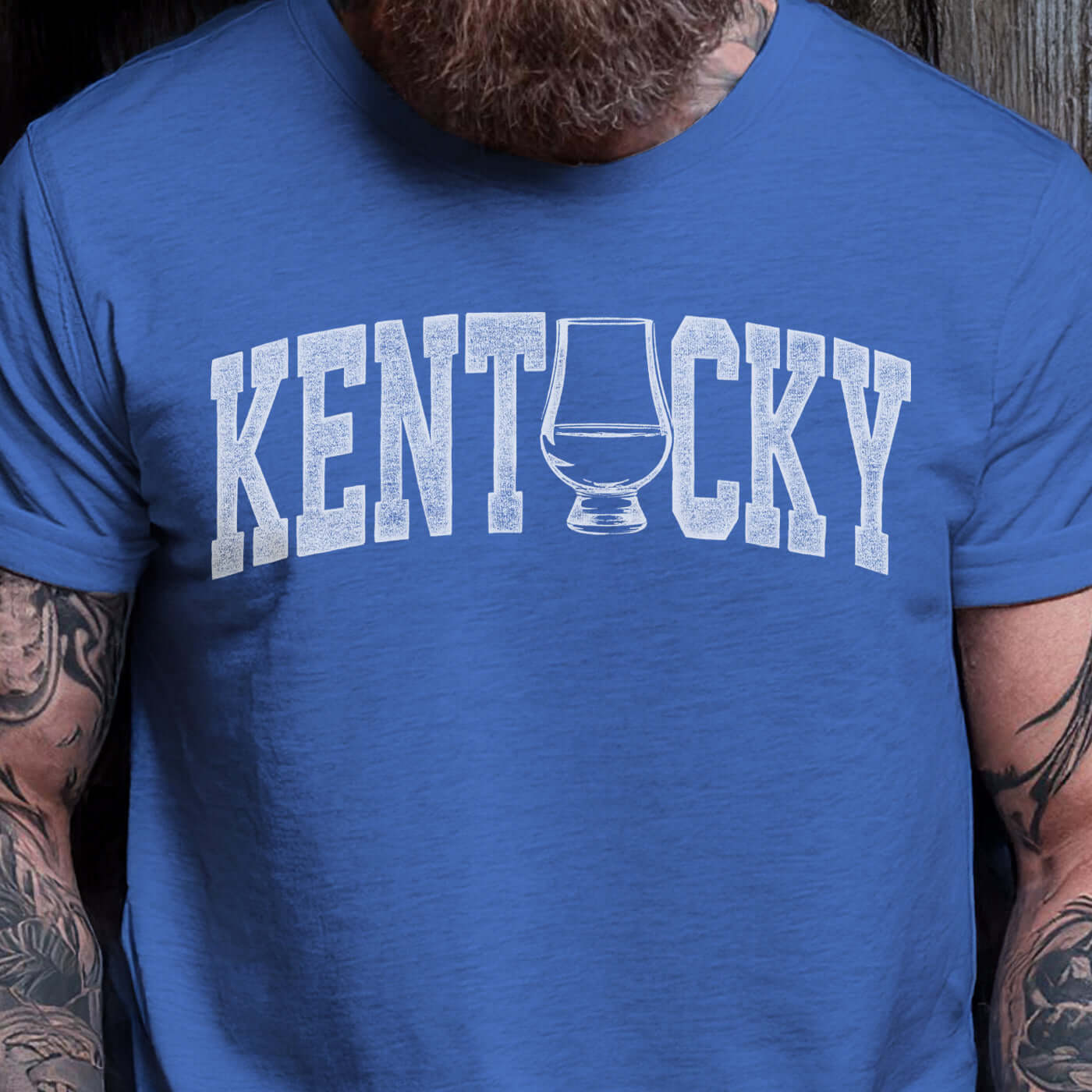 Kentucky whiskey t-shirt featuring a distressed graphic of a whiskey glass, perfect for showcasing state pride.