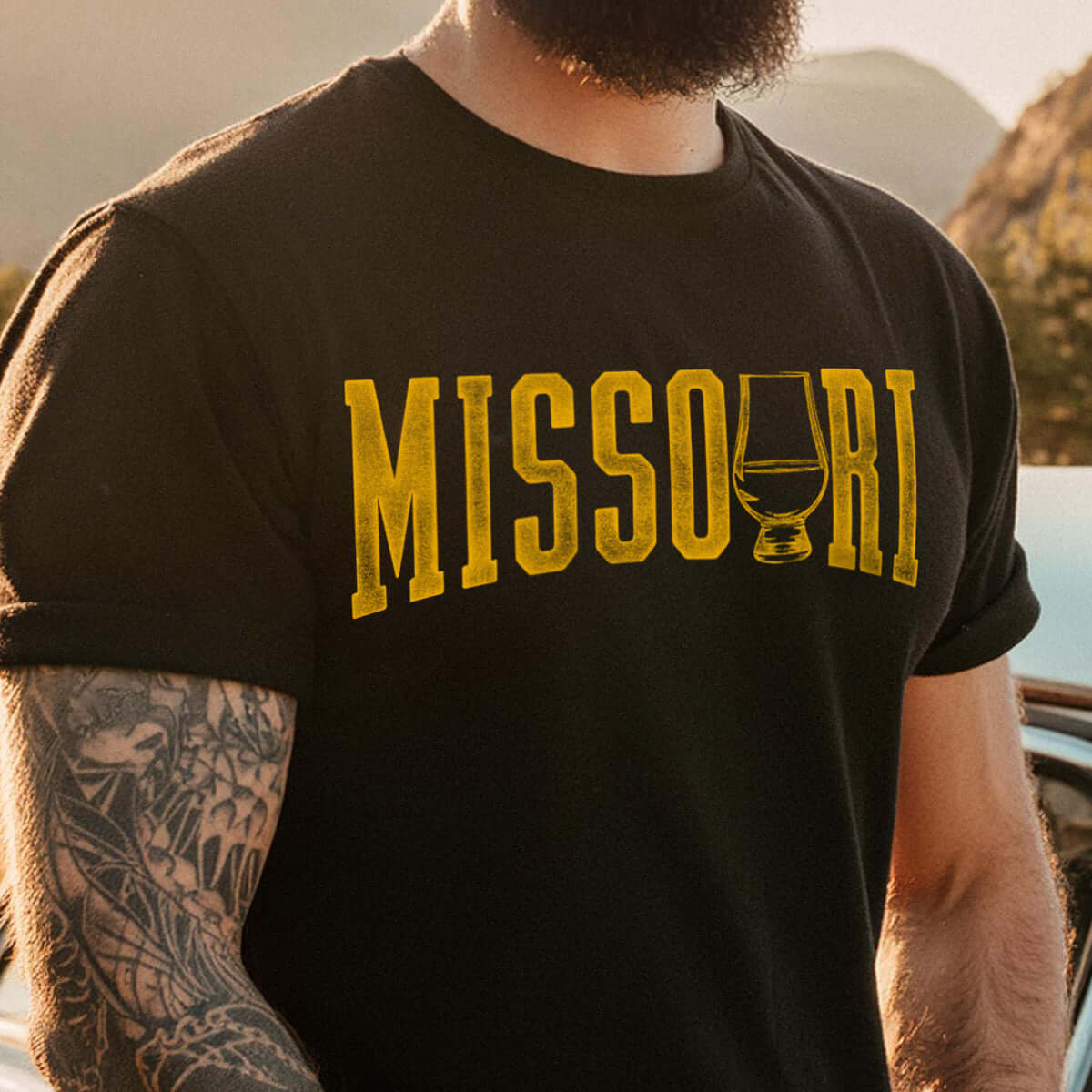 Black Missouri whiskey tee featuring a bold graphic and whiskey glass design, perfect for bourbon enthusiasts.