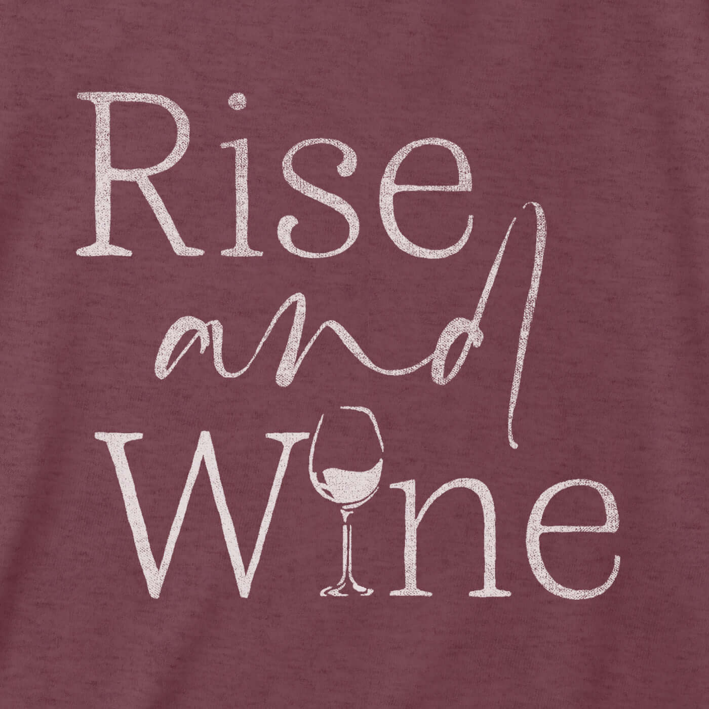 Maroon tri-blend tee featuring a distressed print of 'Rise and Wine' with a wine glass illustration.