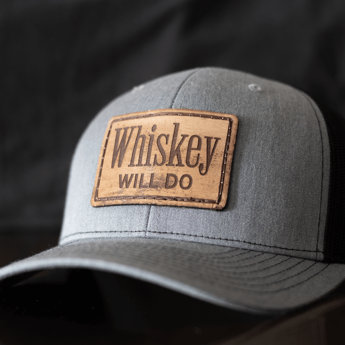 Rustic grey trucker hat with leather patch that says 'Whiskey Will Do', perfect bourbon hat, Richardson 112.