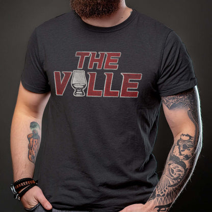 model wearing the ville bourbon t-shirt with a whiskey glass