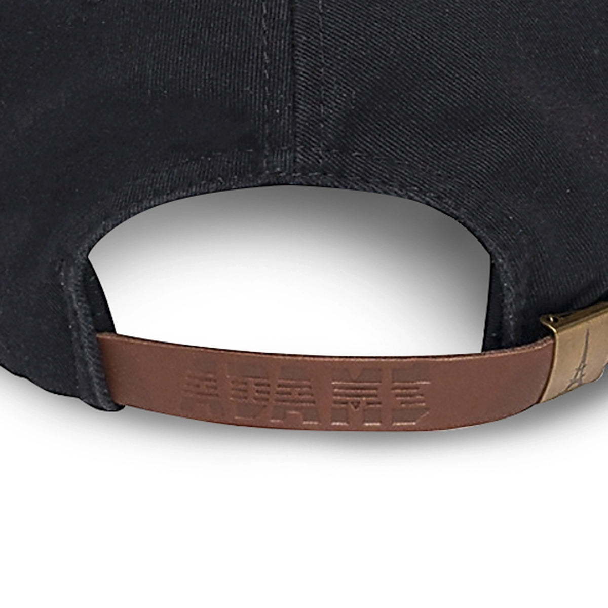 Close-up of the back of a black bourbon helps baseball cap with a brown leather strap and a brass metal adjuster, on a white background.