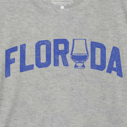 Heather grey Florida bourbon t-shirt featuring a bold blue graphic and whiskey glass design.