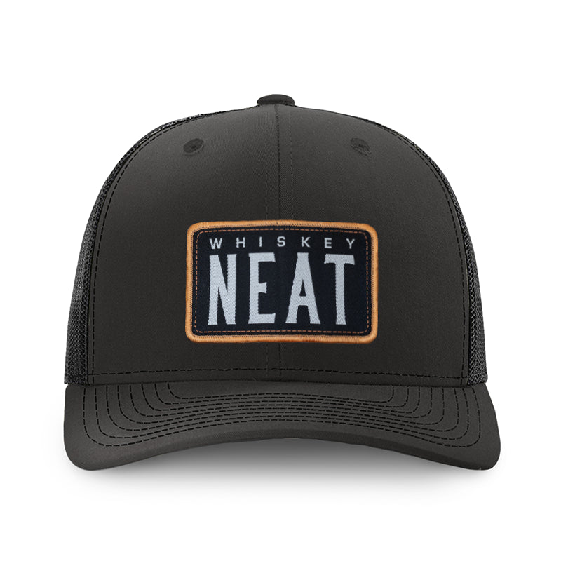 NEAT Whiskey Hat - Black featuring a bold patch with 'WHISKEY NEAT' on a Richardson 112 hat.