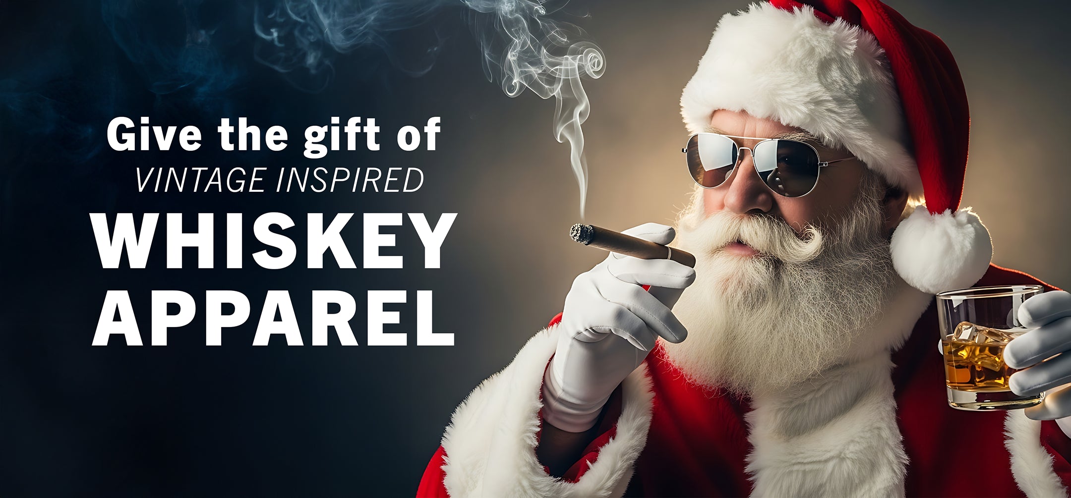 santa holding a cigar and glass of whiskey with text that reads "give the gift of vintage inspired whiskey apparel"